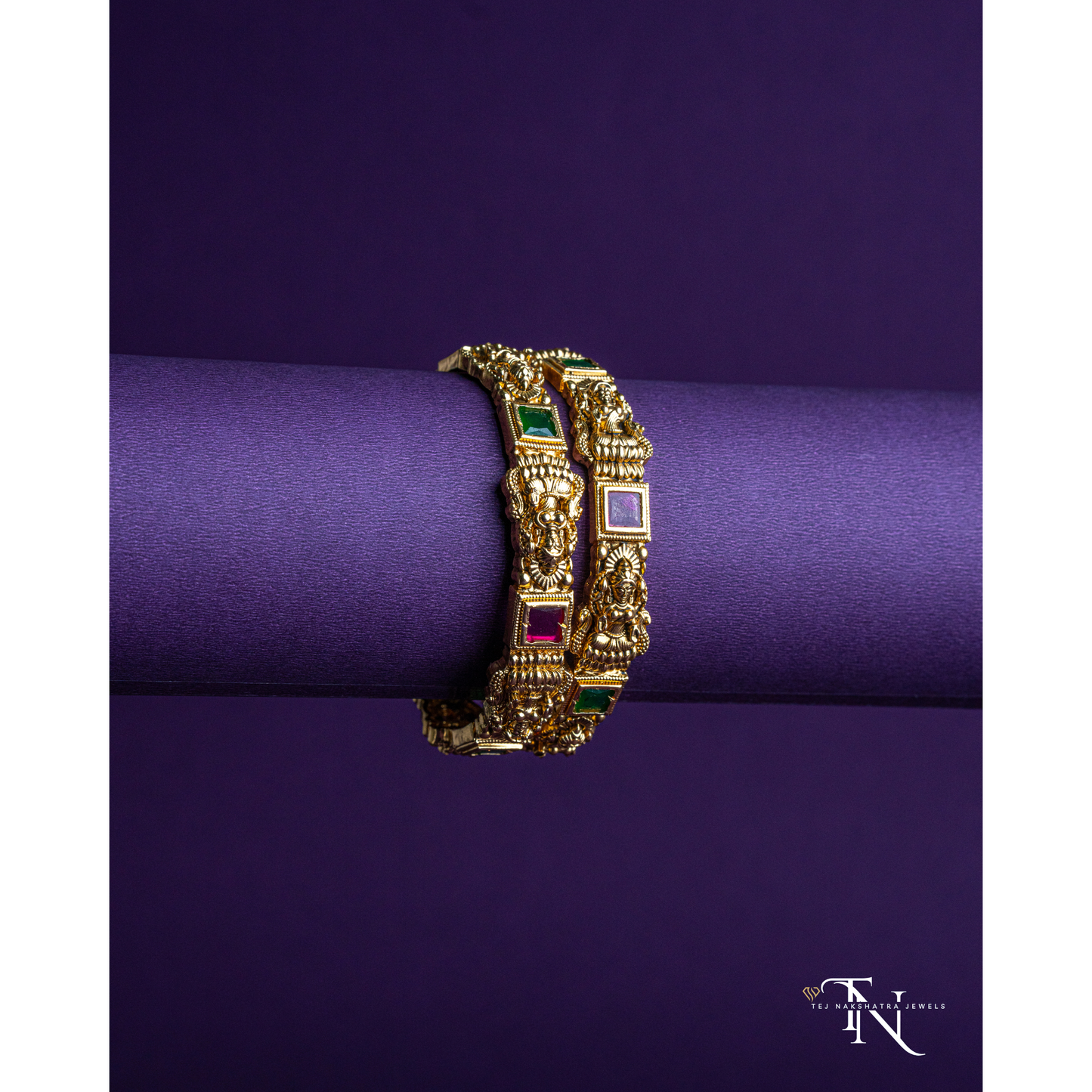 Festive Lakshmidevi Bangles with Rich Red and Green Stone Embellishments